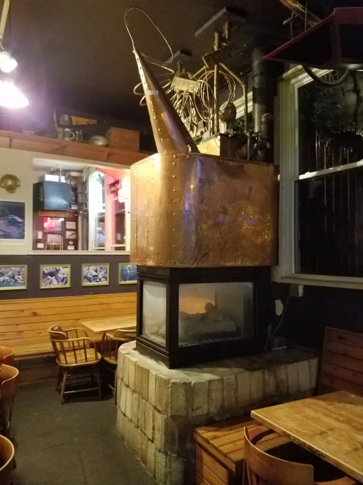 The copper-clad fireplace in the back room of the Duchess Tavern